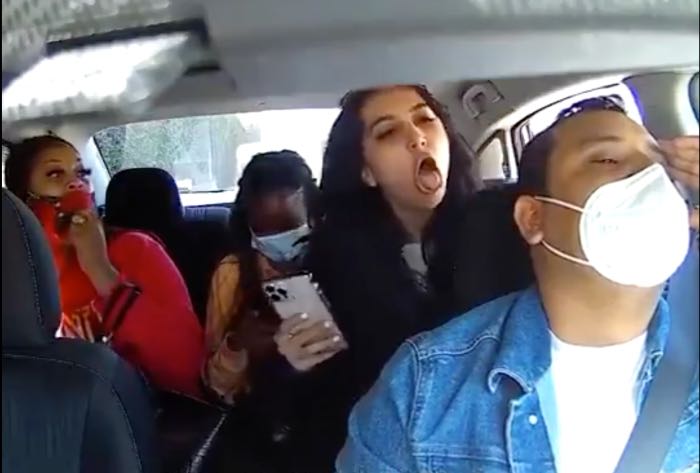 Woman coughing on Uber driver